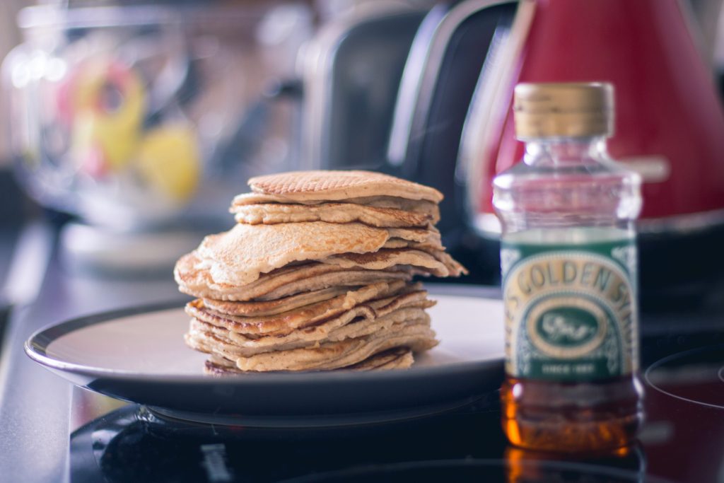 A delicious stack of fluffy pancakes on a plate.