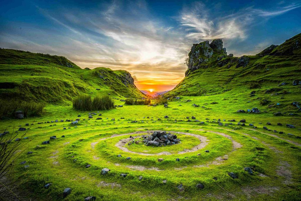 Green grass field during sunset photo