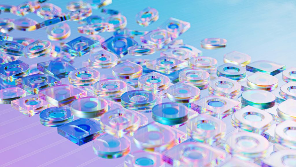 A group of clear glasses on a blue background