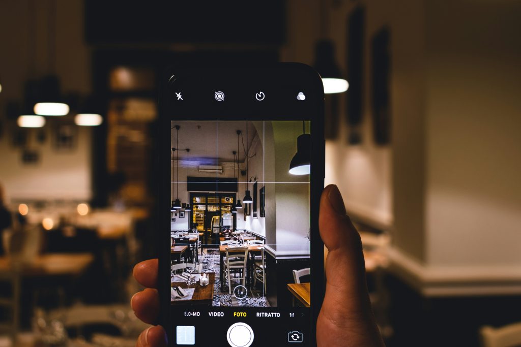 someone takes a picture of a livingroom on iphone