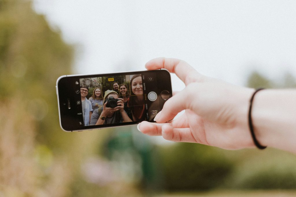 A group of people taking a selfie